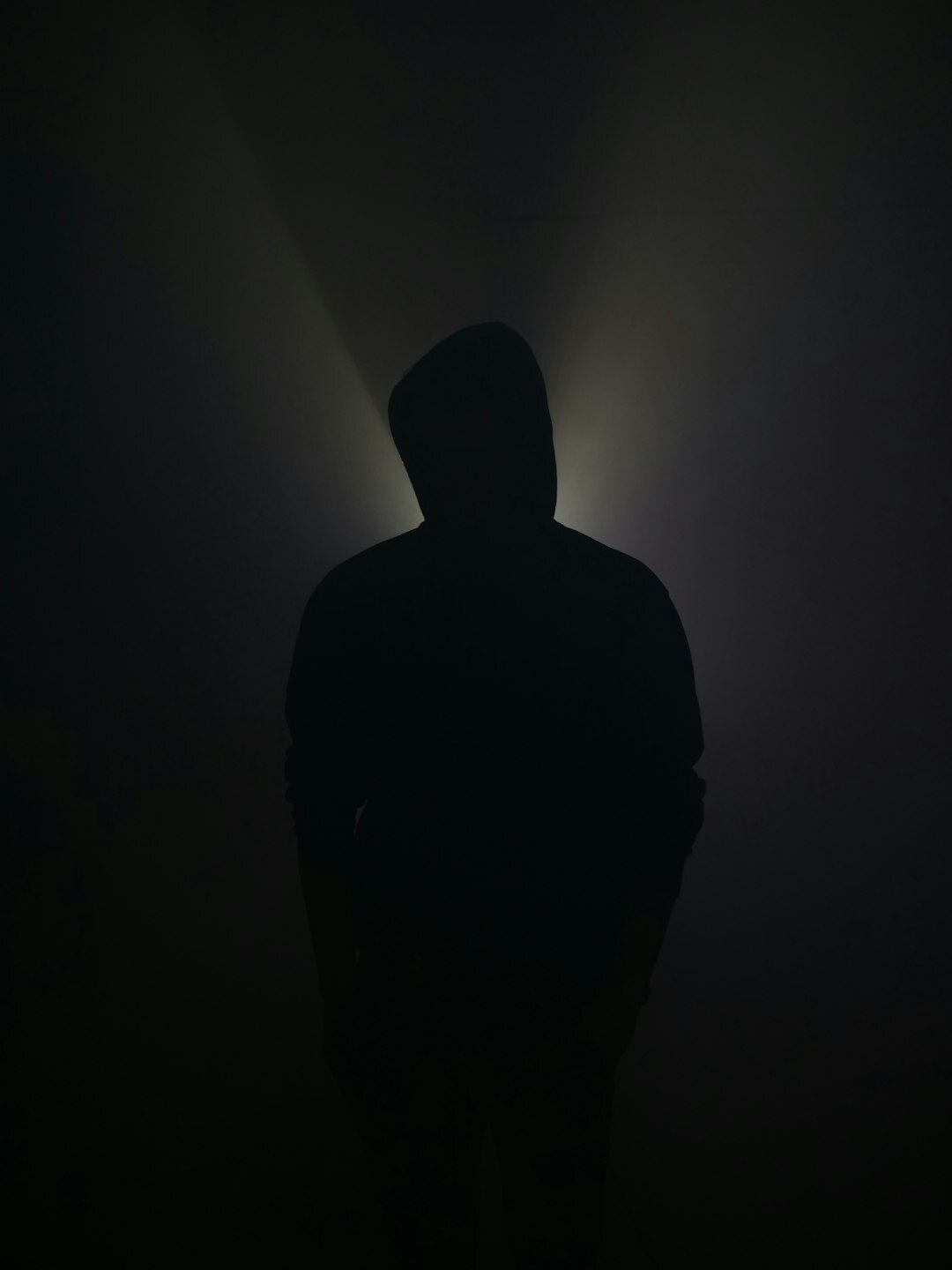 mysterious man in shadows